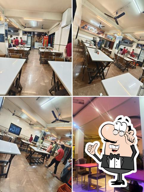 Take a seat at one of the tables at Hotel Aarman