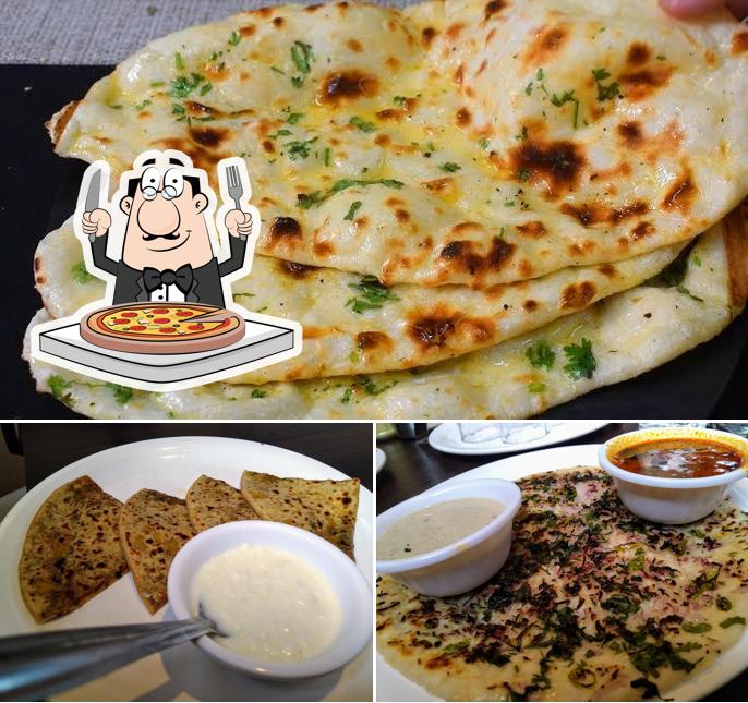 Order pizza at Jijau Restaurant (Pure Veg)