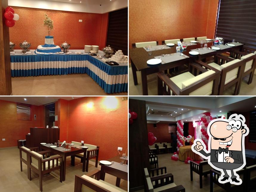 Take a seat at one of the tables at SS BeachResort Restaurant