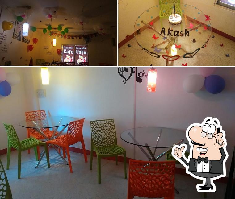 This is the photo showing interior and cake at Celebration Cafe