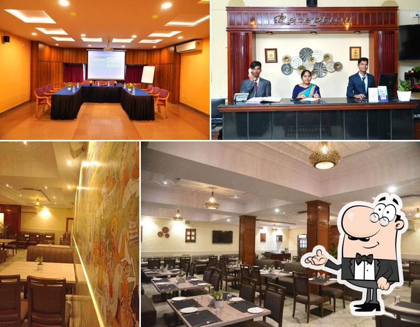 Take a seat at one of the tables at Hotel Vijaya Residency
