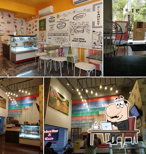 Take a seat at one of the tables at Fruit Shop on Greams Road, T. Nagar