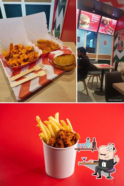 Take a look at the image displaying interior and beverage at KHA - Burgers, Fries, Fried Chicken