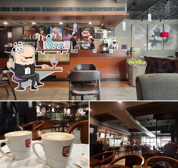 Take a seat at one of the tables at Café Coffee Day