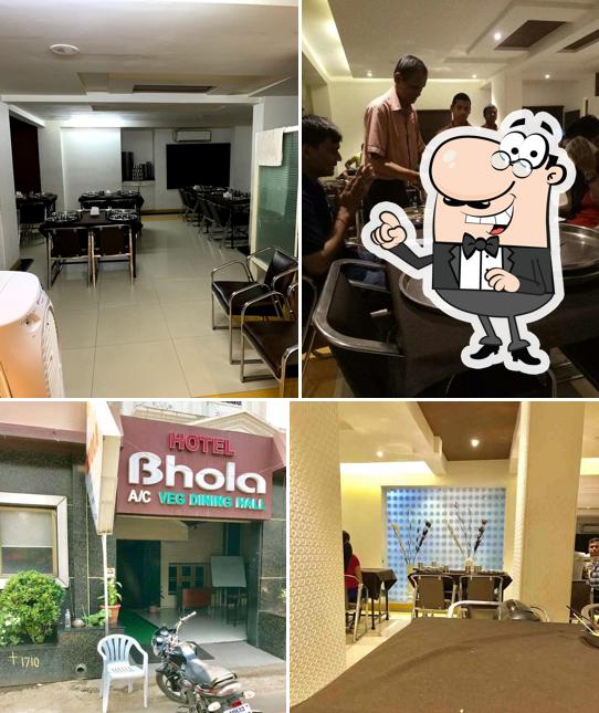 Take a seat at one of the tables at Hotel Bhola