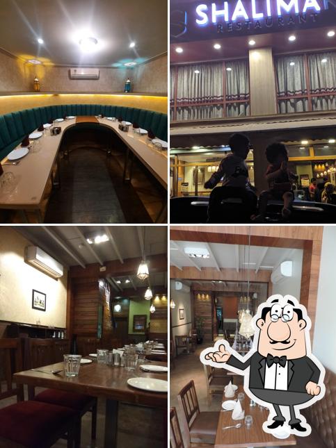 Take a seat at one of the tables at Shalimar Restaurant