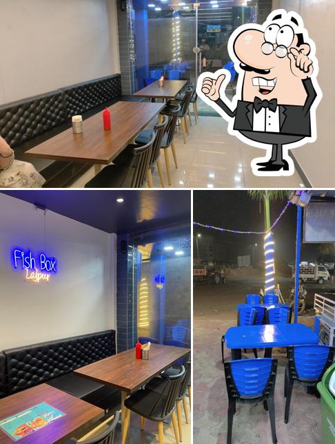 Take a seat at one of the tables at Fish Box (Lajpur)