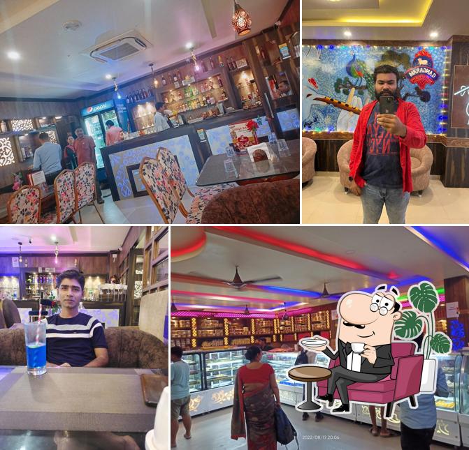 Take a seat at one of the tables at Ganga Ram - Family Restaurant (Pure Veg)