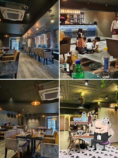 Take a seat at one of the tables at Kwality Restaurant & Bar