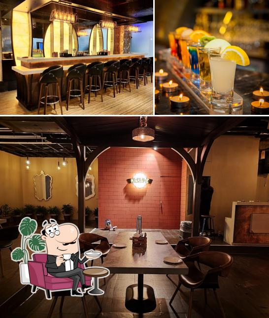 This is the image depicting interior and beverage at Madras Leaf - A Multi Cuisine Restaurant