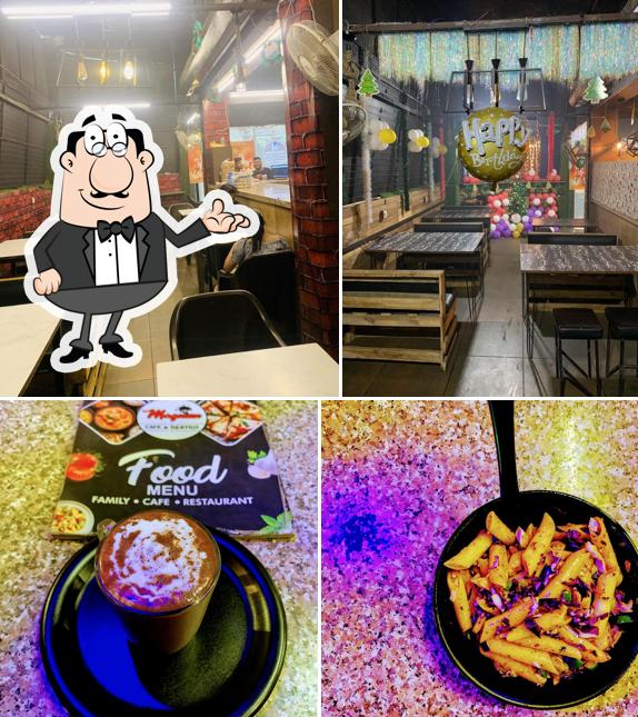 Take a seat at one of the tables at Magnum Cafe & Restro