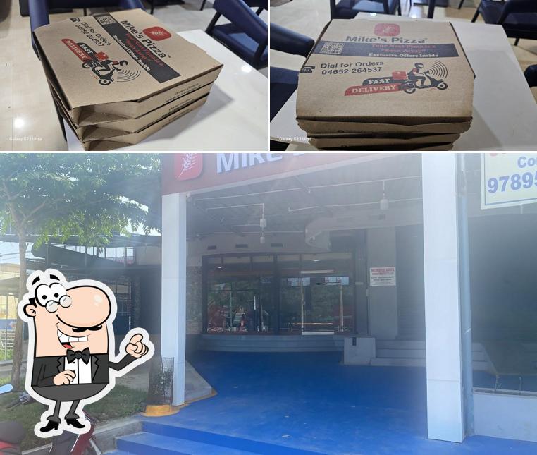Check out the image displaying interior and exterior at Mike's Pizza