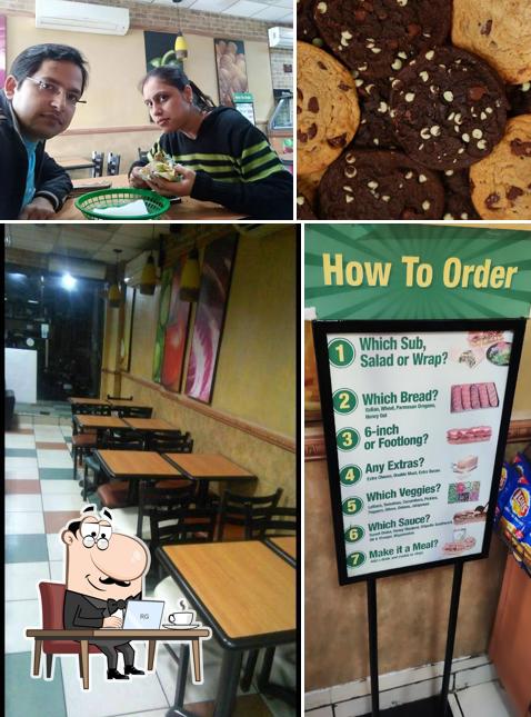 Take a seat at one of the tables at Subway Hari Nagar