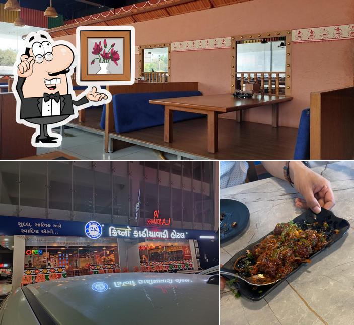 Take a seat at one of the tables at Krishna Kathiyawadi Hotel & Banquet