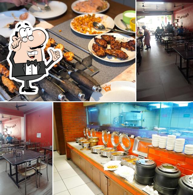 Take a seat at one of the tables at Barbeque Nation- Salem