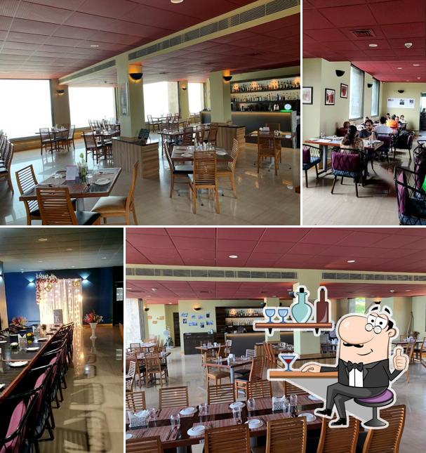 Take a seat at one of the tables at The Pier - Seaside Bistro