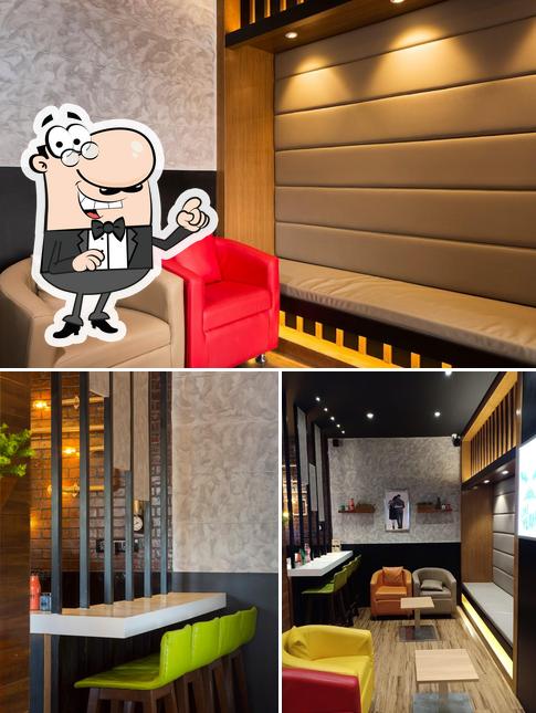 Take a seat at one of the tables at Frozen Bottle - Milkshakes, Desserts, and Ice Cream
