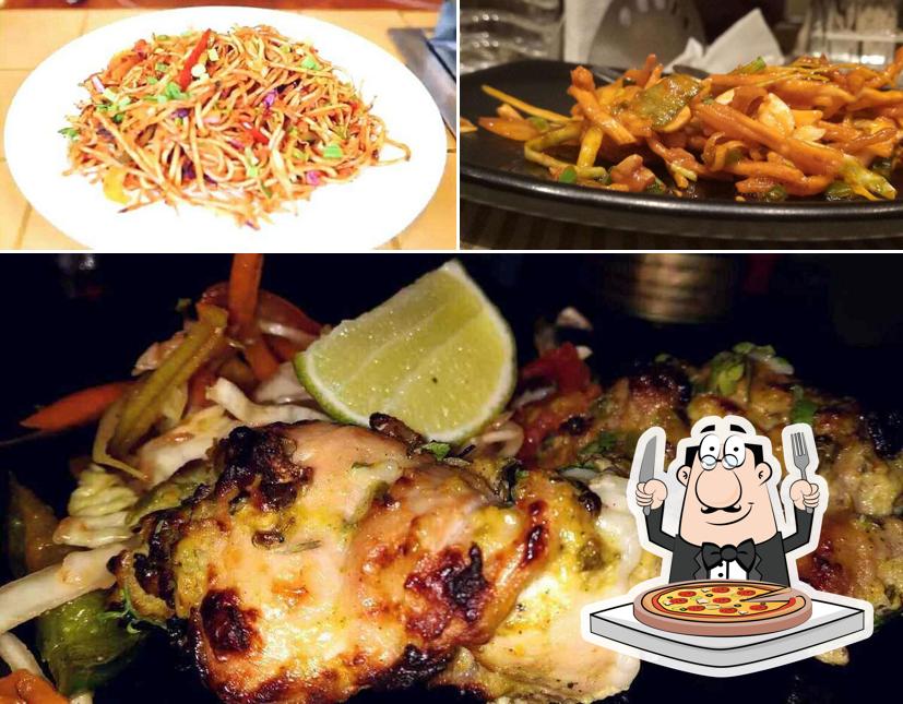 Get pizza at Leela Family Restaurant