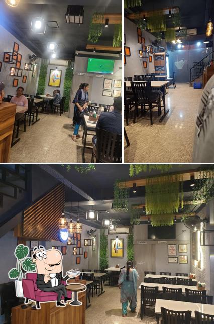 Take a seat at one of the tables at Micky's Kitchen-Best Restaurant in Bilaspur/Fast Food Delivery/South Indian Restaurant