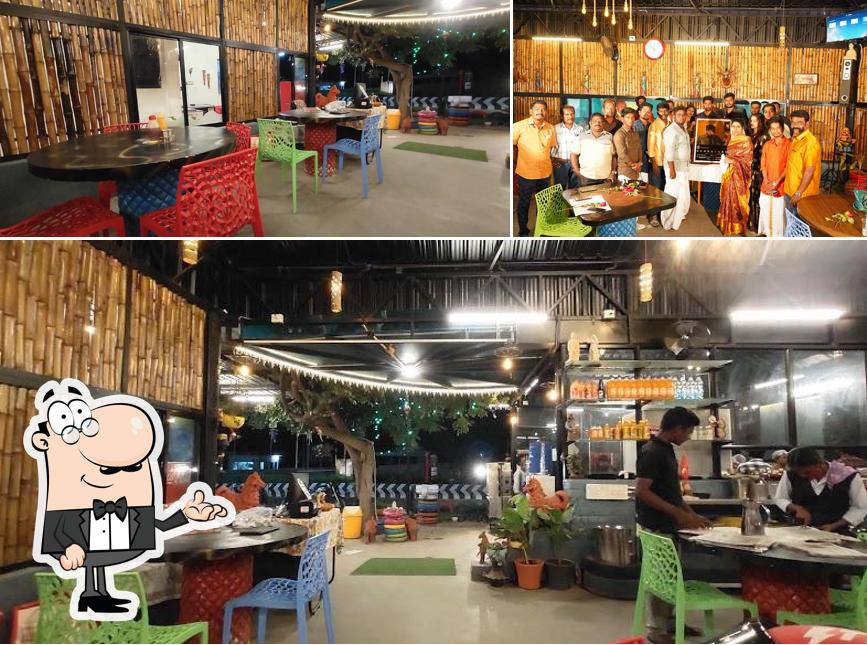 Take a seat at one of the tables at Moto Space Restaurant & party Hall A/C