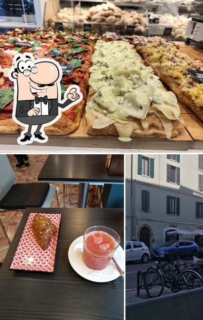 Guarda la foto che presenta la interni e pizza di El forner