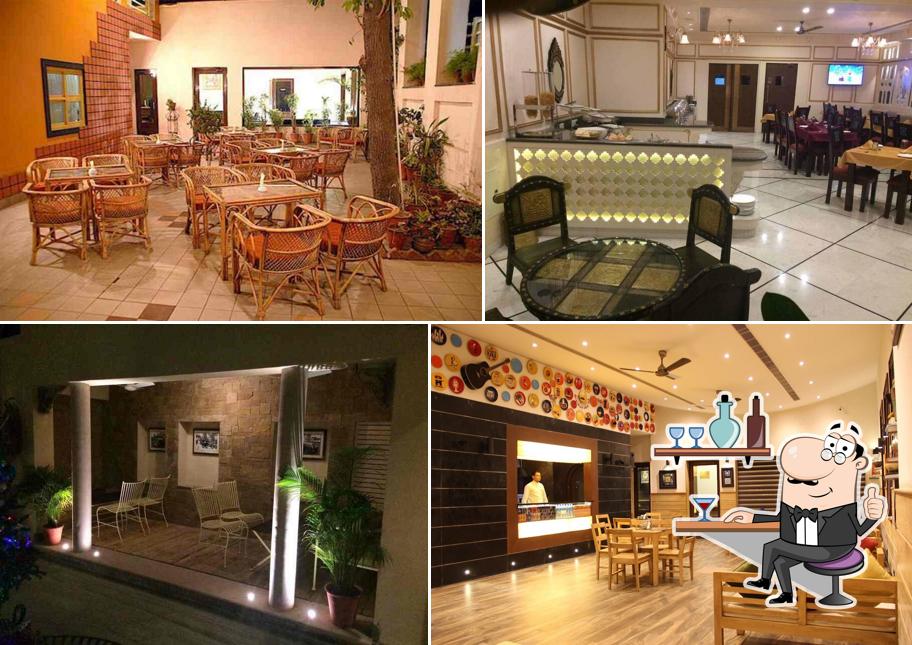 Take a seat at one of the tables at Ratnawali - A Vegetarian Heritage Hotel