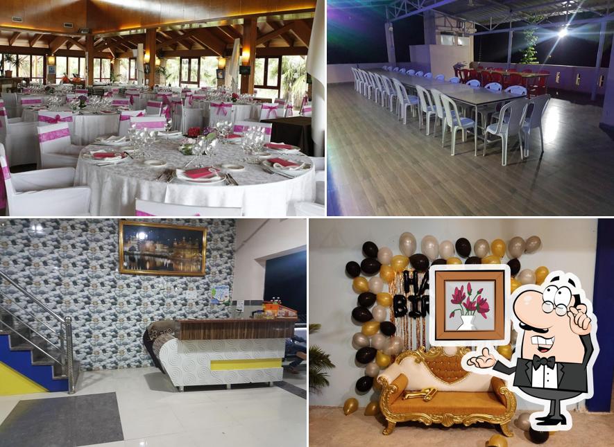 Take a seat at one of the tables at Singh Brothers Pure Veg Hotel and family restaurant