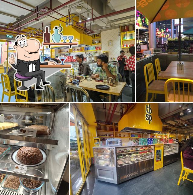 Take a seat at one of the tables at tbsp. - Tablespoon / Pizza, Pasta, BBQ - DLF Cyber Hub Take a seat at one of the tables at tbsp. - Tablespoon / Pizza, Pasta, BBQ - DLF Cyber Hub
