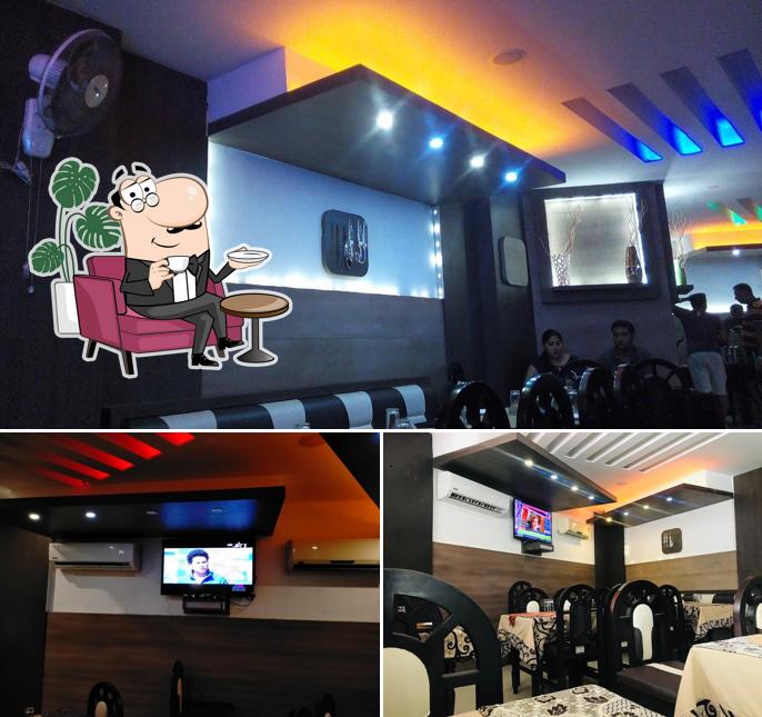 Take a seat at one of the tables at Kana Restaurant