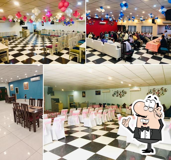 Take a seat at one of the tables at Blue Pluto Restaurant & Jalsa Lawn EP