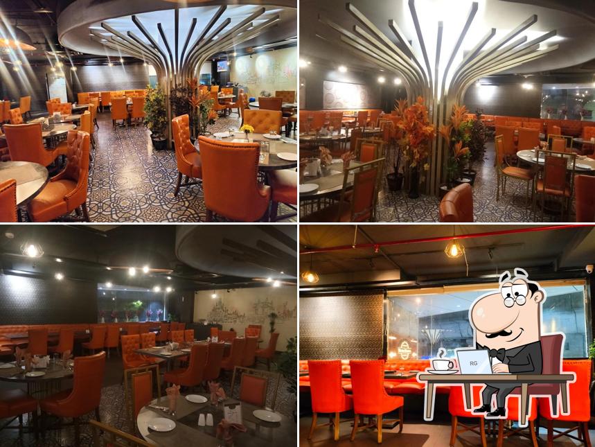 Take a seat at one of the tables at Mumbai Masalaa - Narayanguda