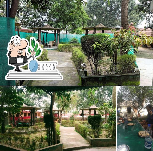 SUMANGLAM HOTEL & FAMILY RESTAURANT is distinguished by exterior and dining table