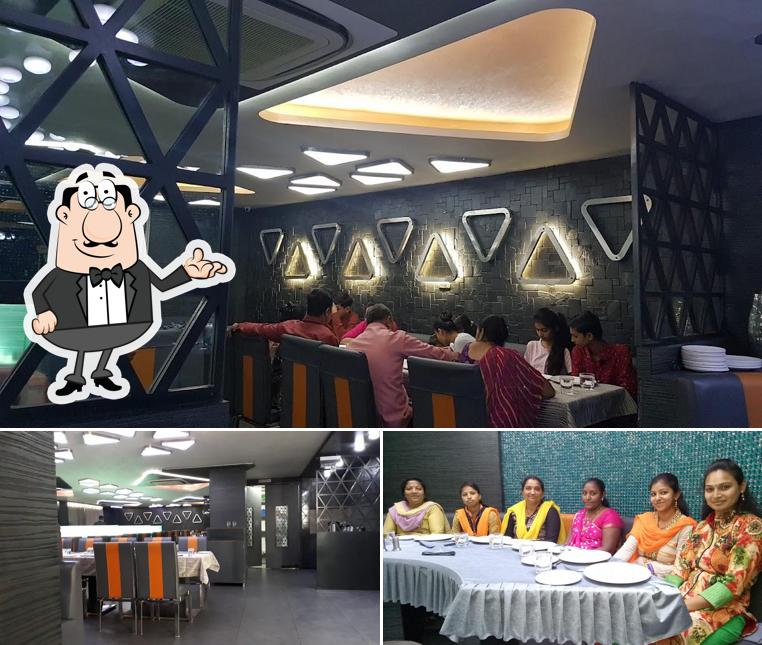Take a seat at one of the tables at Zesty Treat Restaurant and Banquets