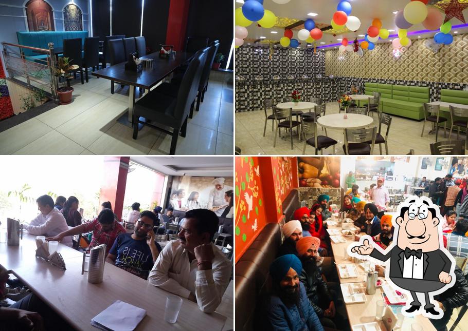 Take a seat at one of the tables at Aneja Sweets & Bakers