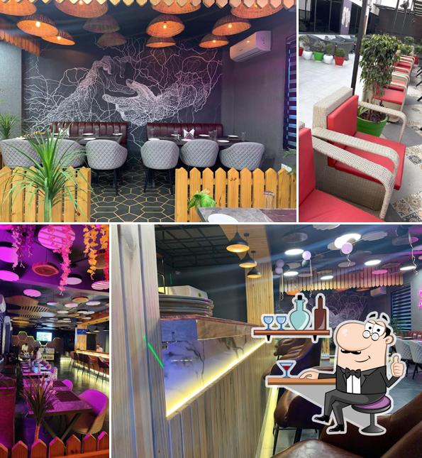 Take a seat at one of the tables at FUSION BAR & LOUNGE