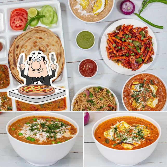 Pick pizza at Arihant Restaurant & Banquet