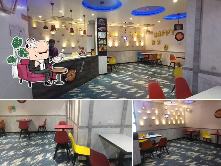 Take a seat at one of the tables at Burger point