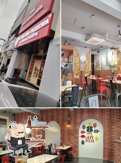 Take a seat at one of the tables at La Milano Pizzeria