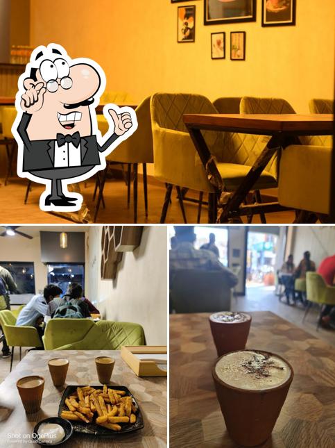The image of interior and dining table at Chai Sutta Bar - Ambala