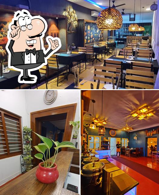 Take a seat at one of the tables at N Veedu Restaurant