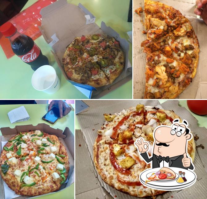 At Domino's Pizza Sugghar, Palampur, you can get pizza