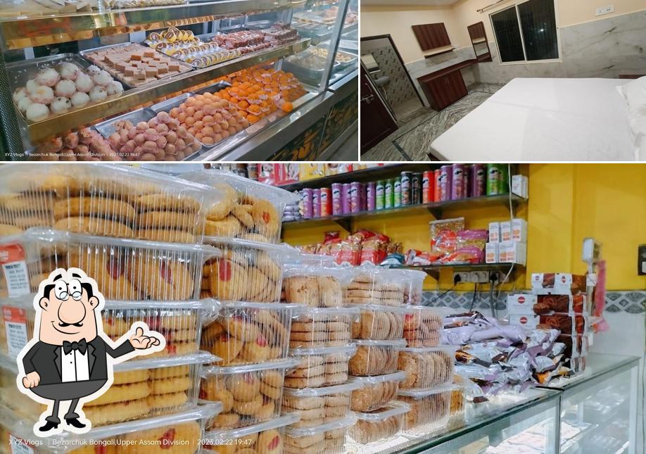 Take a seat at one of the tables at New Shankar Hotel