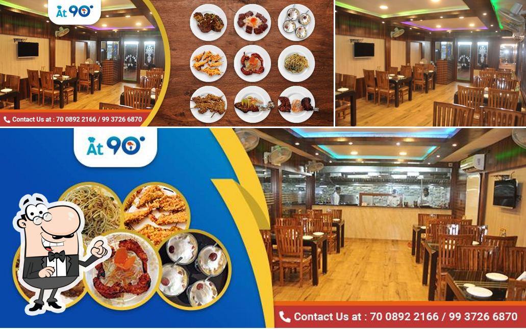 Take a seat at one of the tables at At 90 degree Restaurant Bhubaneswar