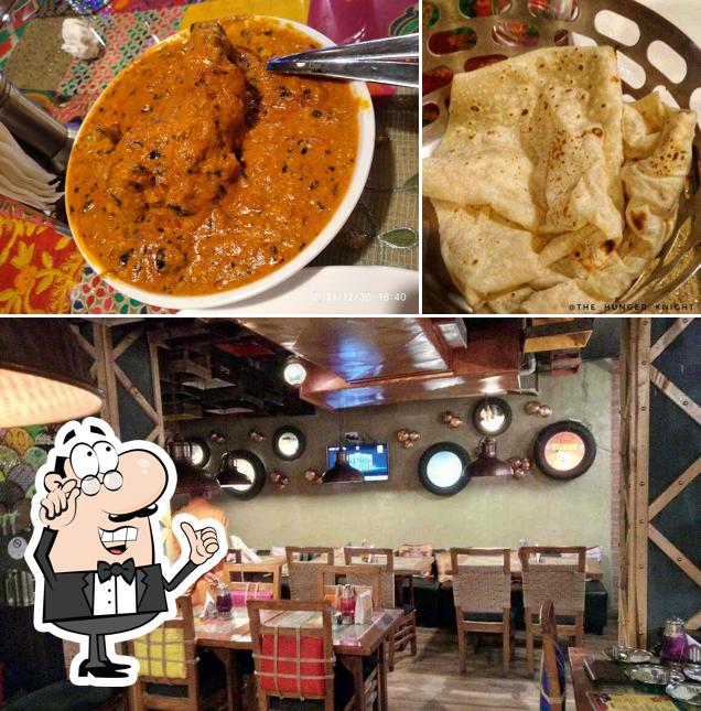 Take a seat at one of the tables at Oye Balle Balle Dhaba