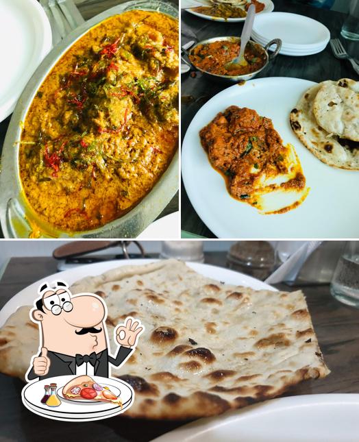Order pizza at Aman Restaurant