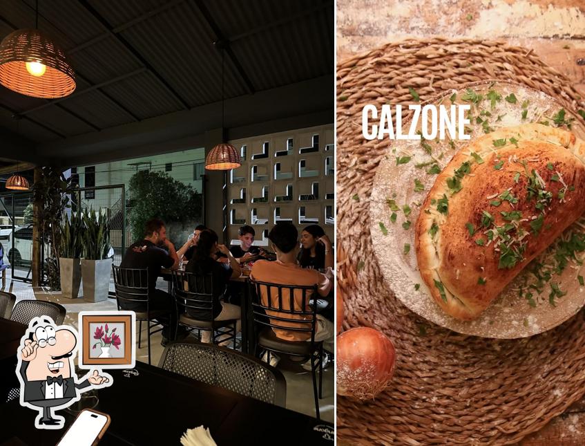 Sente em uma das mesas no Rangone Pizzaria