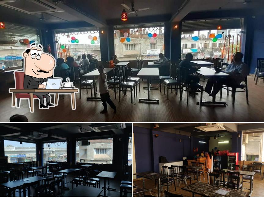 Take a seat at one of the tables at Pizza Paradise Satna