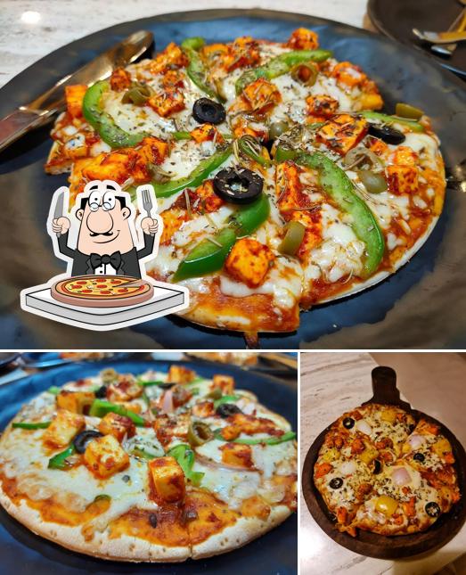 Try out pizza at MCafe Multi Cuisine Restaurants- Lunch home in Kundapura & Kundapura Chicken Special
