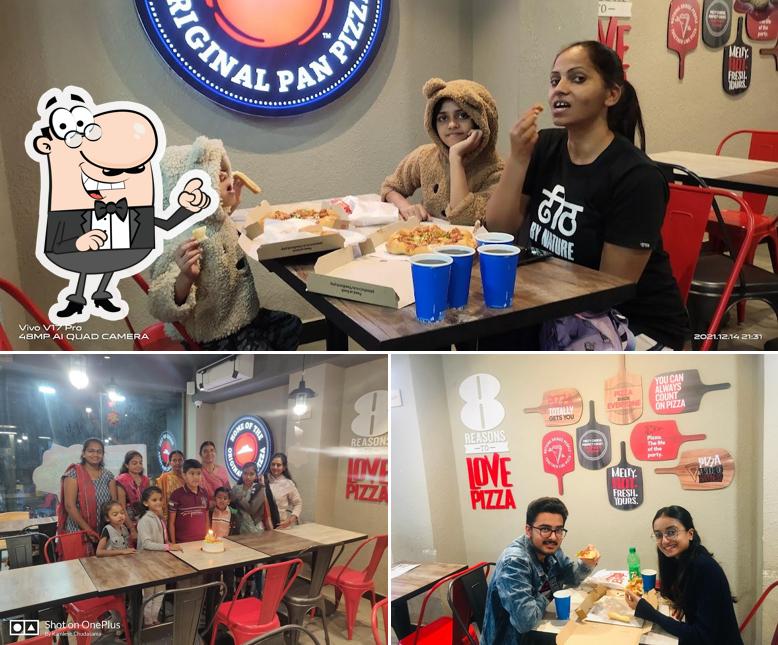 Take a seat at one of the tables at Pizza Hut PN Marg, Jamnagar