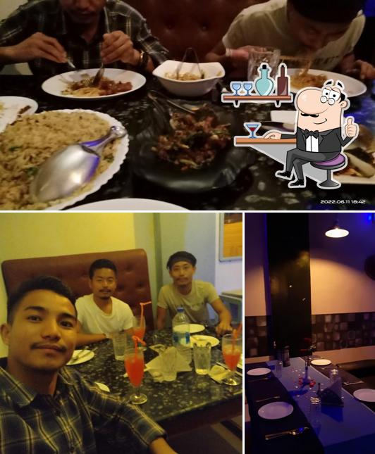 Check out the image depicting interior and food at Sky View